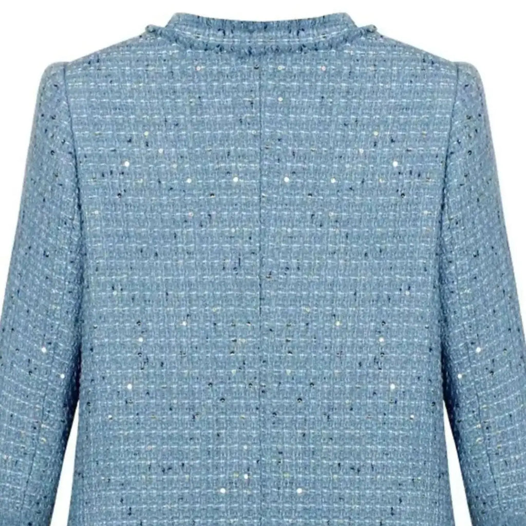 Short blazer with gold buttons, multiple pockets, and a refined design