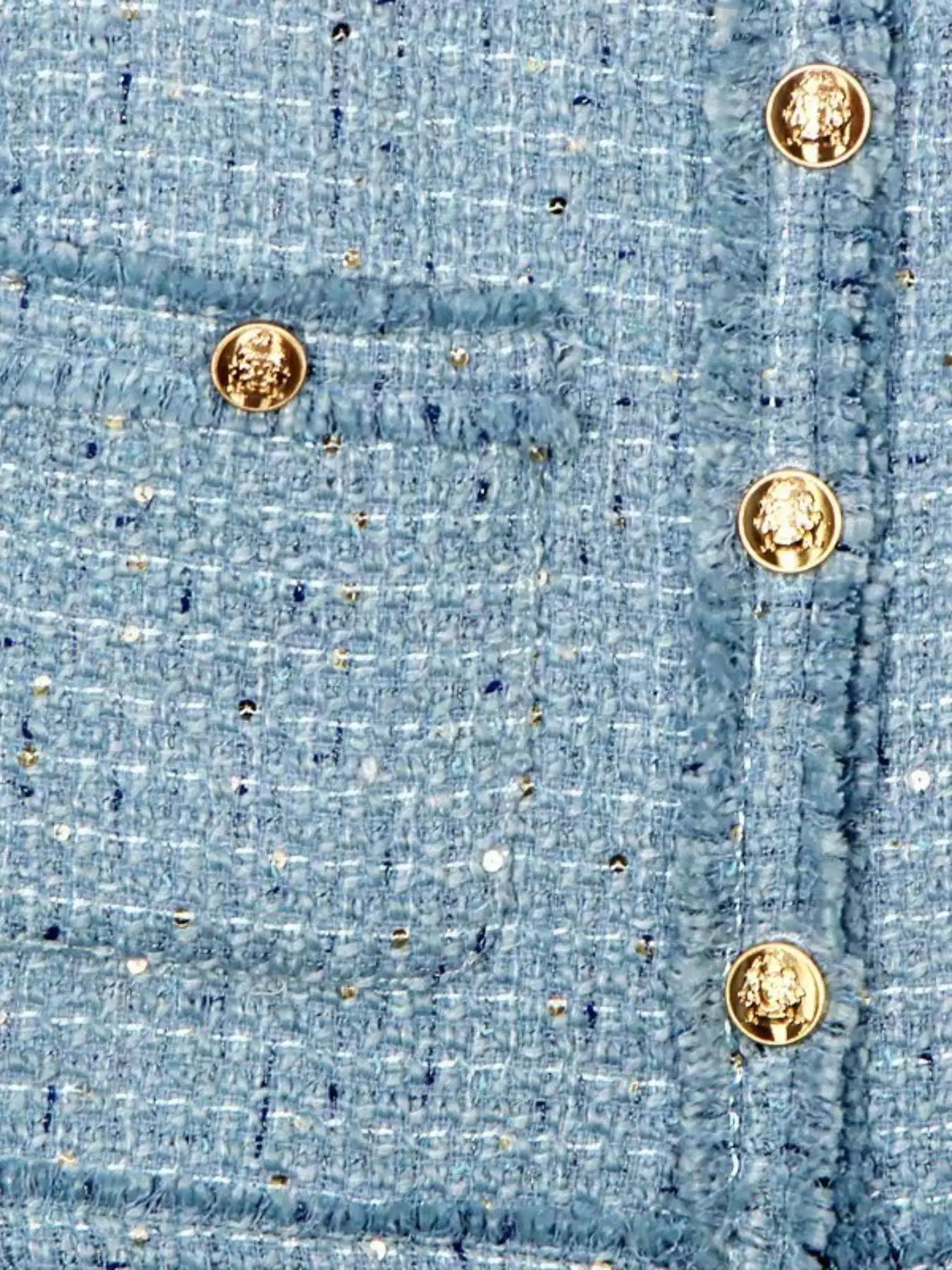 Short blazer with gold buttons, multiple pockets, and a refined design