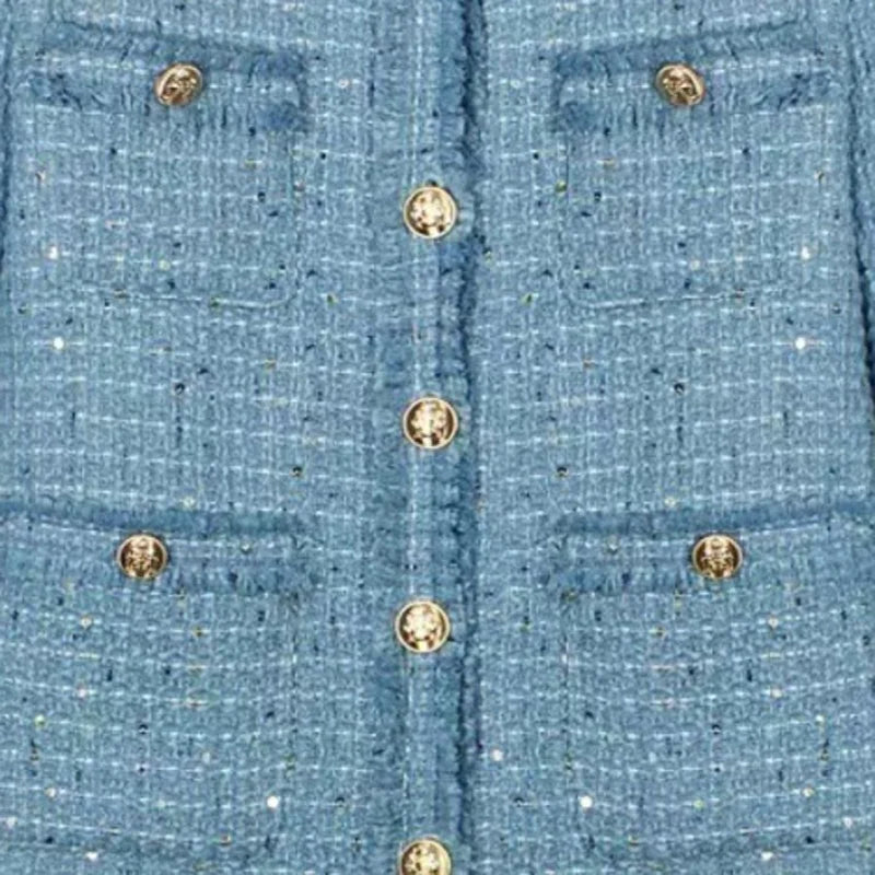 Short blazer with gold buttons, multiple pockets, and a refined design
