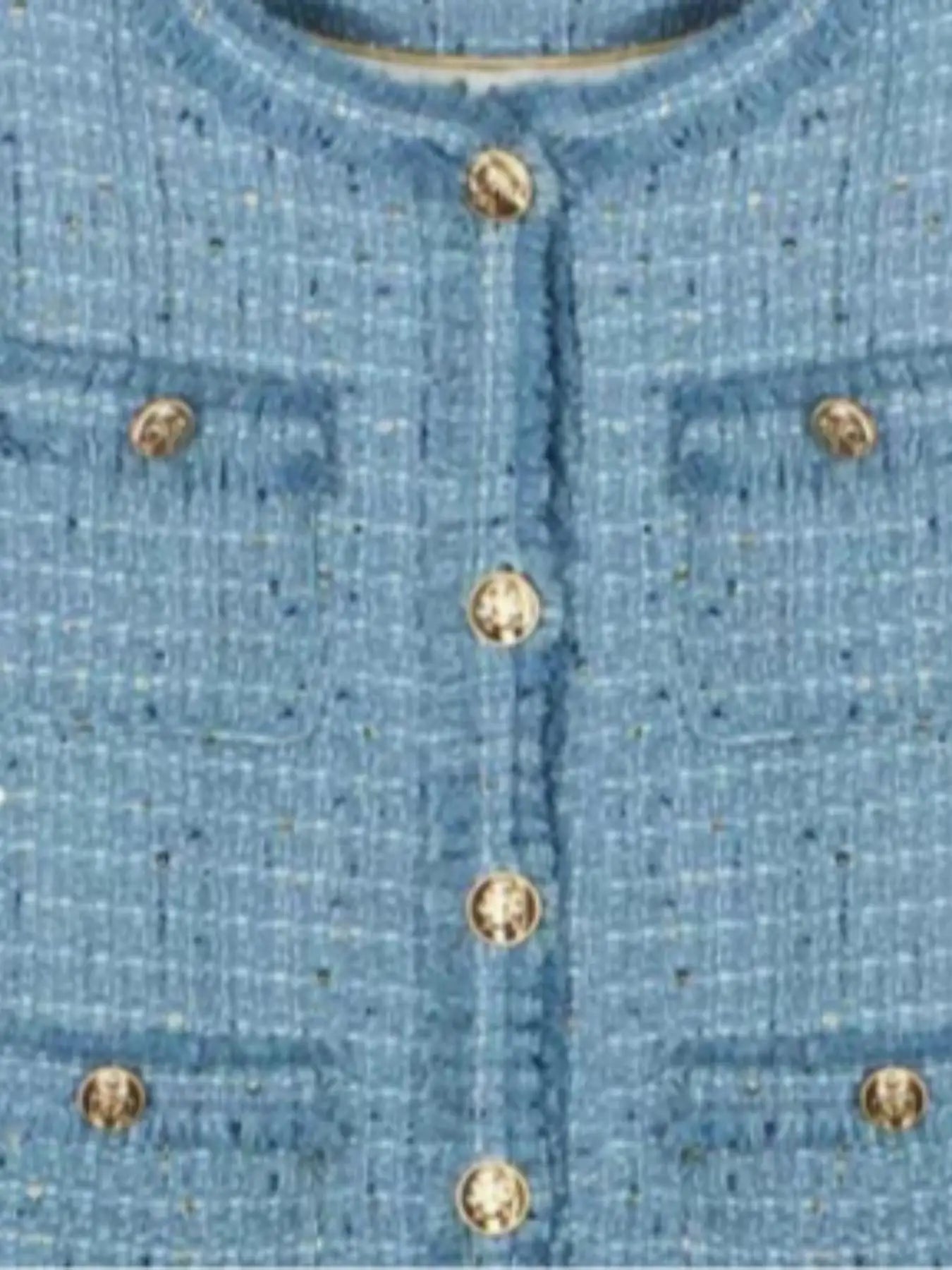 Short blazer with gold buttons, multiple pockets, and a refined design